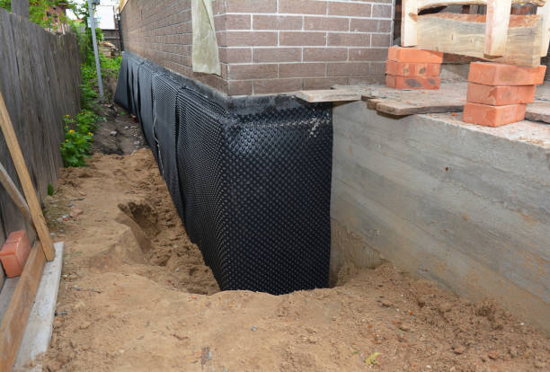 SJ Waterproofing Pros technician performing targeted Exterior Waterproofing assessment in Fredericktown, OH